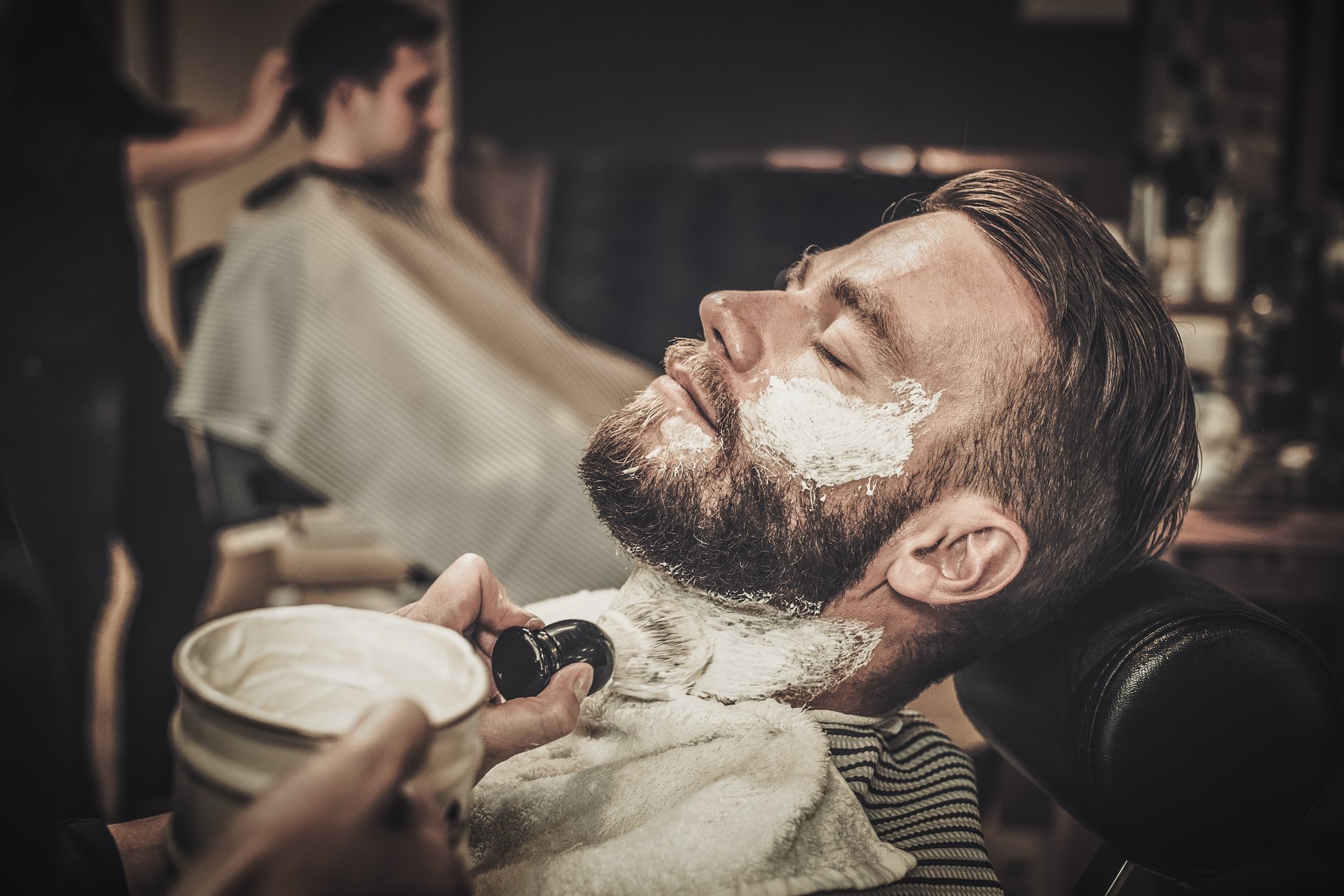 Client during Beard Shaving in Barber Shop